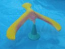 Image of model bird balanced on its pedestral