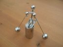 Image of model skier balanced on its pedestral